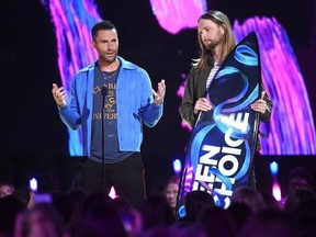 Adam Levine, left and James Valentine of Maroon 5, accept the decade award at the Teen Choice Awards at the Galen Center on Sunday, Aug. 13, 2017, in Los Angeles. (Photo by Phil McCarten/Invision/AP)