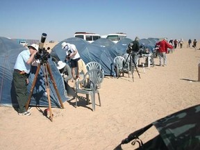 The Royal Astronomical Society of Canada set up to observe an eclipse at a camp south of Jalu, Libya in this March 29, 2006 handout photo. Joe Carr&#039;s most memorable total solar eclipse had ties to former Libyan dictator Moammar Gadhafi. He stayed in a tent in the Sahara Desert supplied by Gadhafi to house dedicated eclipse chasers. &ampquot;That was a very interesting introduction to eclipse viewing,&ampquot; said Carr, who is a member of the Royal Astronomical Society of Canada, Victoria. THE CANADIAN PRESS/HO