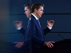 Leader of the Conservative Party of Canada, Andrew Scheer, makes an announcement and holds a media availability at the National Press Theatre in Ottawa on Thursday, July 20, 2017. A pledge by Conservative Leader Andrew Scheer to yank federal funding from universities that fail to uphold free speech wouldn&#039;t apply to a decision by the University of Toronto to ban a nationalist rally from campus, his spokesman said Wednesday. THE CANADIAN PRESS/Sean Kilpatrick