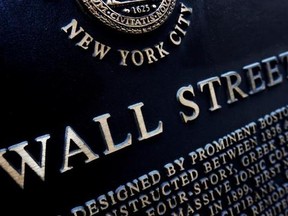 FILE - This Jan. 4, 2010, file photo shows an historic marker on Wall Street in New York. U.S. stocks continued to skid early Friday, Aug. 18, 2017, as industrial companies fell after a weak report from farm equipment giant Deere. (AP Photo/Mark Lennihan, File)