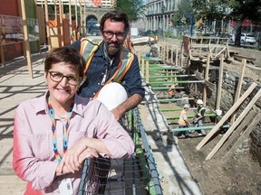 Chief archeologist Louise Pothier and the director of operations Hendrik Van Gijseghem are seen on the site of the archeological dig of the pre-Confederation parliament, Monday, August 14, 2017 in Montreal. THE CANADIAN PRESS/Paul Chiasson