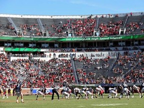 FILE - In this Oct. 29, 2016, file photo, Louisville lines up for a play against Virginia during an NCAA college football game in Charlottesville, Va. ESPN broadcaster Robert Lee will not work Virginia‚Äôs season opener because of recent violence in Charlottesville sparked by the decision to remove a statue of Confederate Gen. Robert E. Lee. A spokeswoman for ESPN says Lee has been moved to Youngstown State‚Äôs game at Pittsburgh on the ACC Network on Sept. 2. The network says the decision was m