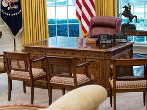 The Resolute Desk is seen in the newly refreshed Oval Office of the White House in Washington, Tuesday, Aug. 22, 2017, during a media tour. During an update of the West Wing, the Oval Office got new wallpaper and the floors were refinished. The draperies and furnishings are all part of the White House collection and were used by previous presidents. (AP Photo/Carolyn Kaster)