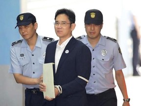 Lee Jae-yong, vice chairman of Samsung Electronics Co., arrives for his trial at Seoul Central District Court in Seoul, South Korea, Friday, Aug. 25, 2017. The court will rule Friday in a bribery case against the billionaire heir to the Samsung empire that fed public anger leading to the ouster of Park Geun-hye as South Korea&#039;s president. Prosecutors have sought a 12-year prison term for Lee. (Chung Sung-Jun/Pool Photo via AP)