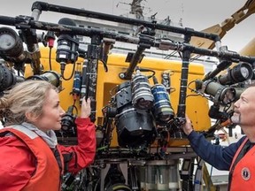 Onboard the Martha L. Black, Robert Rangeley (right), Director of Science at Oceana Canada and Alexandra Cousteau, Senior Oceana Advisor, inspect the ROPOS after a dive. The ROPOS is a state-of-the-art underwater robot that can collect samples and scientific data as well as high definition video while submerged during the Gulf of St. Lawrence Expedition. The expedition is a joint venture between Oceana Canada and Fisheries and Oceans Canada.THE CANADIAN PRESS/HO-Oceana Canada MANDATORY CREDIT