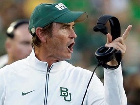 FILE - In this Sept. 12, 2015, file photo, Baylor coach Art Briles yells from the sideline during the first half of an NCAA college football game against Lamar in Waco, Texas. The Hamilton Tiger-Cats of the Canadian Football League have hired former Baylor coach Art Briles to be an assistant. The team announced the move Monday, Aug. 28, 2017, via Twitter. (AP Photo/LM Otero, File)