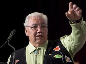 Truth and Reconciliation Commission Chair Justice Murray Sinclair speaks during the Grand entry ceremony during the second day of closing events for the Truth and Reconciliation Commission in Ottawa, Monday June 1, 2015. Sinclair says tearing down tributes that are considered offensive to Indigenous Peoples would be &ampquot;counterproductive&ampquot; because it smacks of anger, not harmony. THE CANADIAN PRESS/Adrian Wyld