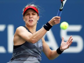Eugenie Bouchard, of Canada, returns a shot from Evgeniya Rodina, of Russia, during the first round of the U.S. Open tennis tournament, Wednesday, Aug. 30, 2017, in New York. (AP Photo/Adam Hunger)