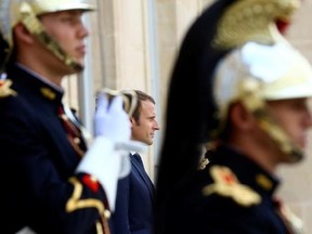 French President Emmanuel Macron, center, waits for leaders at the Elysee Palace in Paris, Monday, Aug.28, 2017. The leaders of France, Germany, Italy and Spain are meeting Monday with counterparts from Libya, Niger and Chad to discuss ways to curb illegal migration across the Mediterranean Sea to European shores. (AP Photo/Thibault Camus)