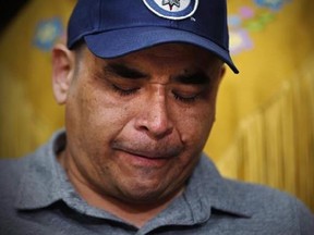 Norway House resident Leon Swanson weeps at a press conference in Winnipeg, Friday, August 26, 2016. Swanson and David Tait Jr. were switched at birth in 1975 when their mothers gave birth at Norway House Indian Hospital. Manitoba RCMP say no charges will be laid after an investigation into two cases of babies switched at birth at a northern Manitoba hospital more than 40 years ago. THE CANADIAN PRESS/John Woods