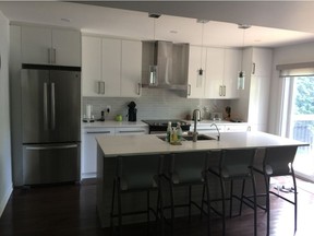 AFTER- The completed kitchen features gorgeously balanced lights- darks and neutrals throughout. It is easily accessible by all family members and has become their favourite room.