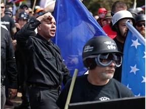 White nationalists, neo-Nazis and members of the "alt-right" exchange insults with counter-protesters as they attempt to guard the entrance to Lee Park during the "Unite the Right" rally August 12, 2017 in Charlottesville, Virginia