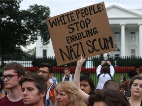 People protesting against racism gather in front of the White House, on Aug. 14 in Washington, DC.