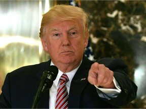 US President Donald Trump speaks to the press about protests in Charlottesville on Aug. 15. JIM WATSON, AFP/Getty Images