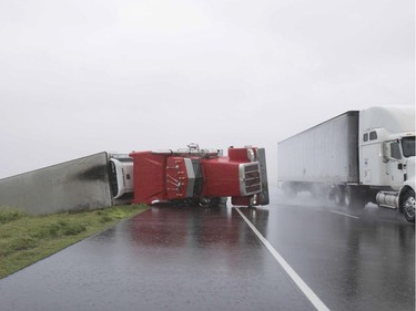 A big rig lies on it's side on Hwy 59 near Edna, Texas, south of Houston, in the aftermath of Hurricane Harvey on August 26, 2017.