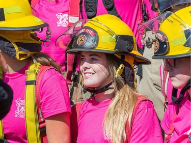 Grace Leslie (C) looks around at her fellow campers as the week long Camp FFIT continues at the Ottawa Fire Services Training Centre.