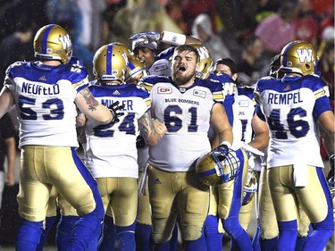Blue Bombers offensive lineman Matthias Goossen (61) celebrates the team's game-winning field goal against the Redblacks on Friday night. THE CANADIAN PRESS/Justin Tang