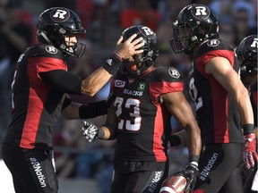 Ottawa Redblacks quarterback Trevor Harris celebrates a touchdown with Mossis Madu Jr in a 31-24 win over B.C. on Saturday, Aug. 27, 2017. The Redblacks' next three games — two against Montreal and one against Hamilton — will be pivotal.