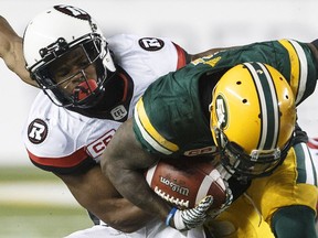 The Ottawa Redblacks' Corey Tindal, above, and Sherrod Baltimore earned praise for their recent play from Antoine Pruneau.