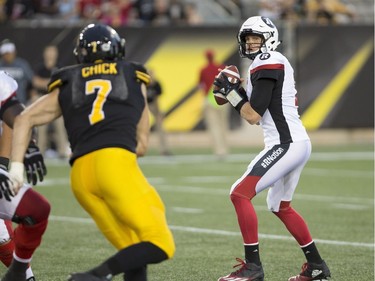 Redblacks quarterback Trevor Harris sets to throw during the second half on Friday night. THE CANADIAN PRESS/Peter Power