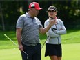 Belen Mozo of Spain walks with Ottawa Senators general manager Pierre Dorion as they take part in the pro-am at the 2017 Canadian Pacific Women's Open of the LPGA Tour in Ottawa on Wednesday, Aug. 23, 2017.