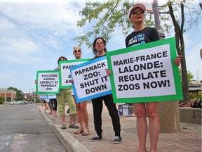 Activists with the Ottawa Animal Defense League are protesting outside the constituency office of MPP Marie-France Lalonde in Ottawa, August 14, 2017.