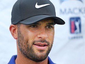 Derek Barron talks to the media after shooting a 9-under-par 62 in the second round of the National Capital Open to Support Our Troops at Hylands Golf Club. Jean Levac/Postmedia