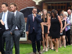 Bryan Murray's nephew Tim Murray leaves Tuesday's private funeral for his uncle in Shawville, August 22, 2017.