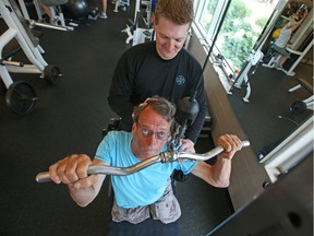 Trainer Ryan Armitage with John Woodhouse, who has dystonia and is a double leg amputee.