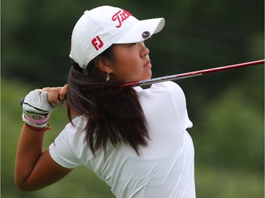 Susan Xiao watches the path of her ball on the third hole.