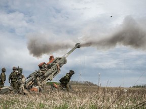 This photo shows Gunner Dawson Maranduik of the Royal Canadian Horse Artillery firing a M-777 during Exercise Double Dragon on May 12, 2017. DND photo.