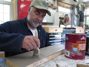 Steve Maxwell creating the latest sample for is 27 year deck stain testing program.
Photo credit: Robert Maxwell