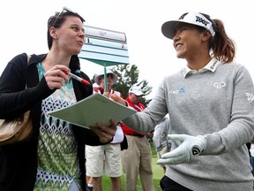 Lydia Ko, a fan favourite in Canada with three Open titles at the age of 20, takes a moment to sign an autograph on Wednesday.
