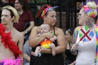 Silas Lessard-Pettigrew, 2 months old, and Grandma Debbie Eaton turned out with big crowds in Centretown for the annual Capital Pride parade on Sunday, Aug. 27, 2017. (David Kawai)