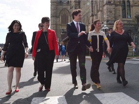 Status of Women Minister Maryam Monsef, left to right, Minister of International Development and La Francophonie Marie-Claude Bibeau, Prime Minister Justin Trudeau, Sophie Gregoire Trudeau and Women Deliver President and CEO Katja Iversen arrive at an event in Ottawa on Tuesday, June 13, 2017. The Liberal government is thinking about using its massive purchasing power to support women in business.