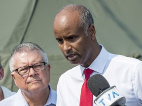 Ralph Goodale Ahmaed Hussen Brenda Shanahan

Ahmed Hussen, right, Minister of Immigration, Refugees and Citizenship, Ralph Goodale, Minister of Public Safety and Emergency Preparedness comment on the influx of asylum seekers crossing the border into Canada from the United States Monday, August 21, 2017 near Saint-Bernard-de-Lacolle, Que. THE CANADIAN PRESS/Paul Chiasson ORG XMIT: pch101
Paul Chiasson,