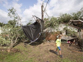 Emile Turcotte Emile Turcotte walks through his backyard as his trampoline hangs from a tree as a result of a category one tornado, Wednesday, August 23, 2017 in Lachute, Que., northwest of Montreal.