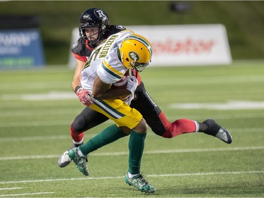 Ottawa's Antoine Pruneau makes a tackle on Edmonton's Vidal Hazelton in the first quarter of Thursday's CFL game at TD Place stadium.  Wayne Cuddington/Postmedia