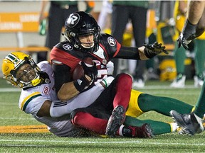 Ottawa QB Trevor Harris is sacked in the second quarter of Thursday's game.   Wayne Cuddington/Postmedia