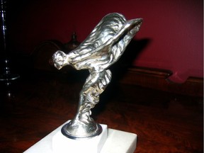 This signed "Spirit of Ecstasy' Rolls Royce mascot was discovered in a pile of old auto parts in a garage.