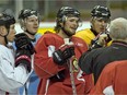 Chris Neil, far left, and Mike Fisher, middle, join Senators teammates in listening to the comments of Bryan Murray, then the team's head coach, during a practice before the 2007 Eastern Conference final against the Buffalo Sabres. Wayne Cuddington/Postmedia