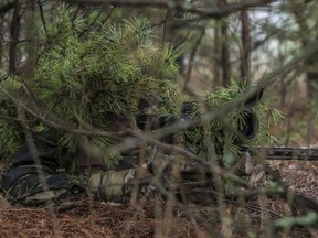 A Canadian Armed Forces sniper looks through his scope while participating in Exercise Without Warning in the training area of Glebokie, Poland on December 17, 2015 during Operation REASSURANCE.

Photo: Corporal Nathan Moulton, Land Task Force Imagery, OP REASSURANCE
RP001-2015-0065-011