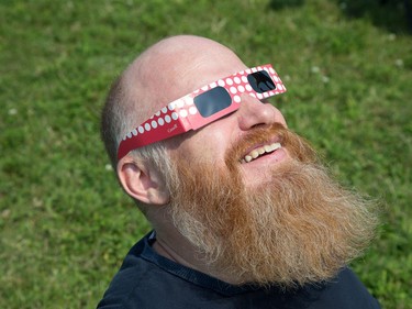 Bryan Beecham watches the eclipse as the partial solar eclipse is observed at an event held by the Royal Astronomical Society at the Canadian Aviation and Space Museum in Ottawa. Photo Wayne Cuddington/ Postmedia
Wayne Cuddington, Postmedia