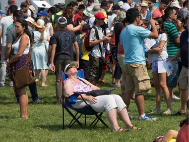 A woman finds her spot to get comfortable as the partial solar eclipse is observed at an event held by the Royal Astronomical Society at the Canadian Aviation and Space Museum in Ottawa. Photo Wayne Cuddington/ Postmedia
Wayne Cuddington, Postmedia