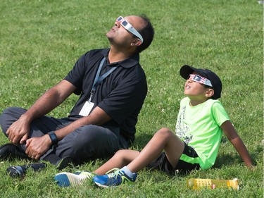 Watching the eclipse required special glasses as the partial solar eclipse is observed at an event held by the Royal Astronomical Society at the Canadian Aviation and Space Museum in Ottawa. Photo Wayne Cuddington/ Postmedia
Wayne Cuddington, Postmedia