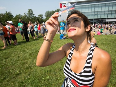 Michele Vidal uses an Eclipse Viewer as the partial solar eclipse is observed at an event held by the Royal Astronomical Society at the Canadian Aviation and Space Museum in Ottawa. Photo Wayne Cuddington/ Postmedia
Wayne Cuddington, Postmedia