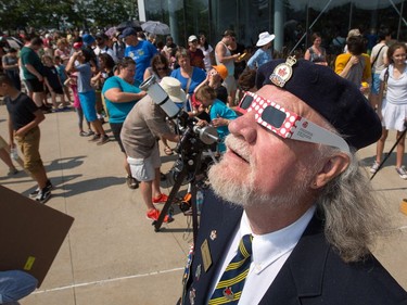Royal Canadian Air Force veteran John MacMillan watches the eclipse as the partial solar eclipse is observed at an event held by the Royal Astronomical Society at the Canadian Aviation and Space Museum in Ottawa. Photo Wayne Cuddington/ Postmedia
Wayne Cuddington, Postmedia