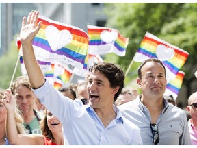 Prime Minister Justin Trudeau, left, and Irish Taoiseach Leo Varadkar, right, participate in the annual pride parade in Montreal, Sunday, August 20, 2017.