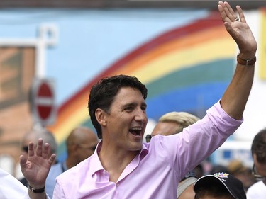 Prime Minister Justin Trudeau marches in the Ottawa Capital Pride parade, Sunday, Aug. 27, 2017. THE CANADIAN PRESS/Justin Tang ORG XMIT: JDT101