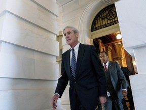 In this June 21, 2017, file photo, former FBI Director Robert Mueller, the special counsel probing Russian interference in the 2016 election, departs Capitol Hill following a closed door meeting in Washington. Mueller is using a grand jury in Washington as part of an investigation into potential coordination between the Trump campaign and Russia, according to a person familiar with the probe.